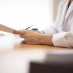 doctor reading a case report