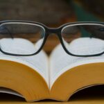 Eyeglasses resting on an open book