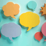 Image shows an array of post-it notes of different speech bubble shapes and colors. Superimposed on it is a typical field of view seen through a camera lens.